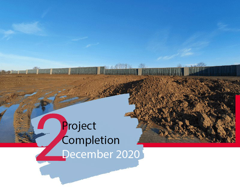 Construction-site-with-noise-barrier-and-monolith-under-a-blue-sky