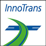 Ein InnoTrans-Logo zeigt eine stilisierte grün-blaue Schienenführung und verweist auf Eisenbahn- und Verkehrsthemen. Text oben im Bild: InnoTrans.